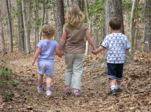 Children hiking through the woods